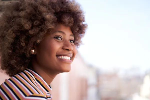 african woman smiling at futur